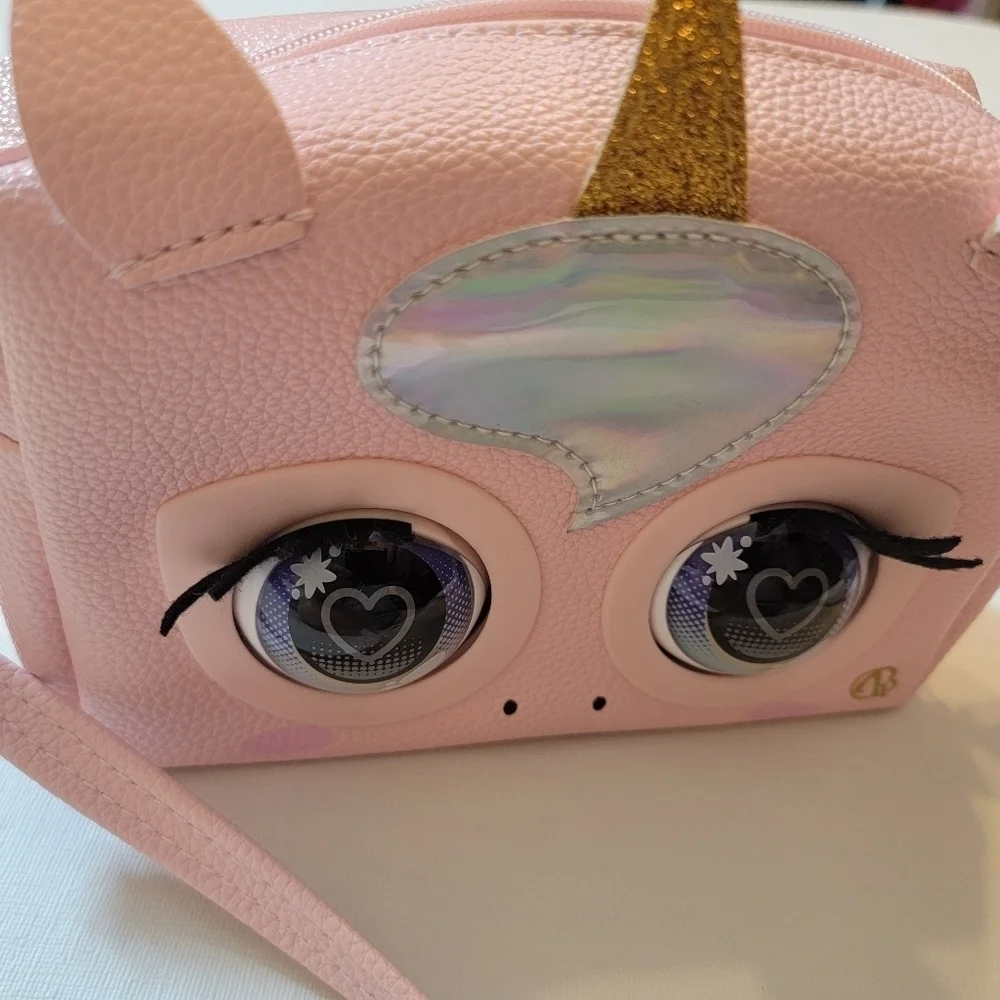 Purse pets pink purse. For 5 yr Olds plus. Comes with batteries and instructions
